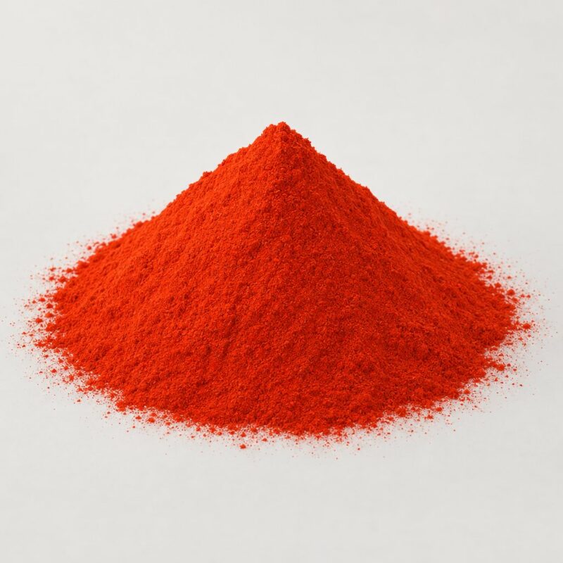 Small mound of bright orange raw coloring powder for tinting tablet binder