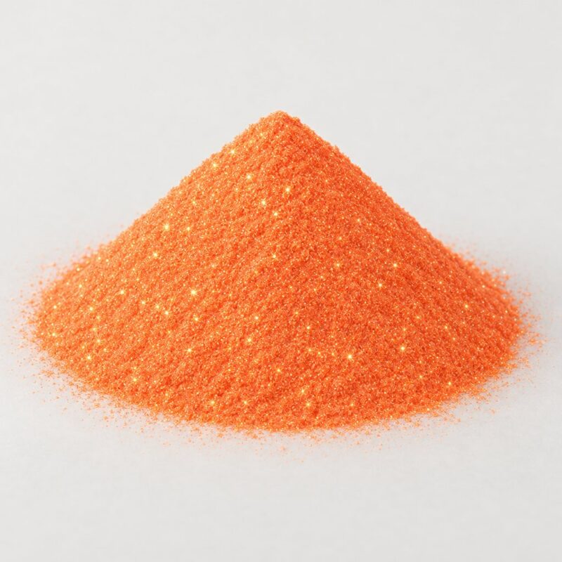 Mound of warm orange sparkle ready mix tablet binder powder with fine glitter