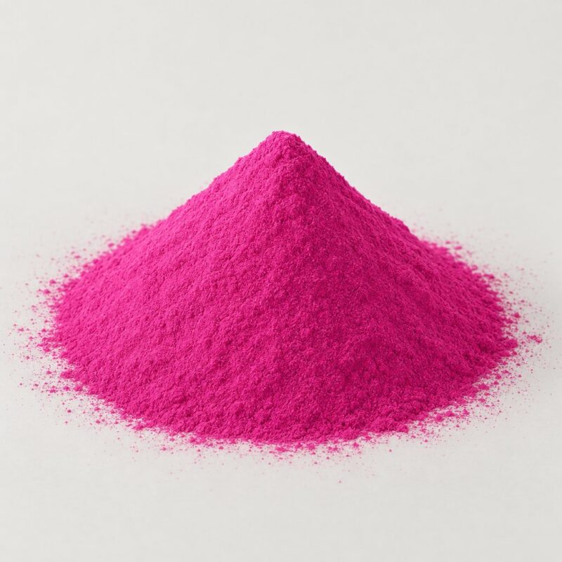 Small mound of concentrated pink raw coloring powder for mixing into tablet binder